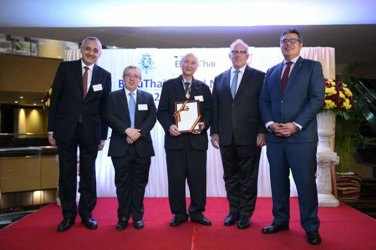[vc_row][vc_column][vc_column_text]It is with our greatest pleasure to announce that one of our senior partners, the honorable Dr. Sutharm Valaisathien has been awarded with the Cross of Commander in the Order of the Crown (Commandeur de l’Ordre de la Couronne) by H.E. Ambassador Philippe Kridelka on behalf of His Majesty the King of the Belgians. The Order of the Crown is bestowed to Dr. Sutharm in recognition for his long year of diplomatic service. Moreover, Dr. Sutharm also resides as President of the Belgian-Luxembourg/Thai Chamber of Commerce where he had been holding the Presidency for the past decade (since 2001). After 10 years of Presidency, Dr Sutharm will become Honorary President of The Belgian-Luxembourg/Thai Chamber of Commerce. We, at ILCT are very proud of Dr Sutharm's effort in straightening the diplomatic relation between Belgium and Thailand.[/vc_column_text][/vc_column][/vc_row][vc_row css=".vc_custom_1638267971019{padding-top: 0px !important;padding-bottom: 0px !important;}"][vc_column width="1/3"][vc_single_image image="14702" img_size="full" alignment="center" onclick="link_image"][/vc_column][vc_column width="1/3"][vc_single_image image="14707" img_size="full" alignment="center" onclick="link_image"][/vc_column][vc_column width="1/3"][vc_single_image image="14709" img_size="full" alignment="center" onclick="link_image"][/vc_column][/vc_row][vc_row css=".vc_custom_1638268059954{padding-top: 0px !important;}"][vc_column css=".vc_custom_1638267693546{padding-top: 0px !important;}"][vc_single_image image="14711" img_size="full" alignment="center" onclick="link_image"][/vc_column][/vc_row]